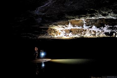 Child exploring the Tunnel Creek, Kimberley, Western Australia